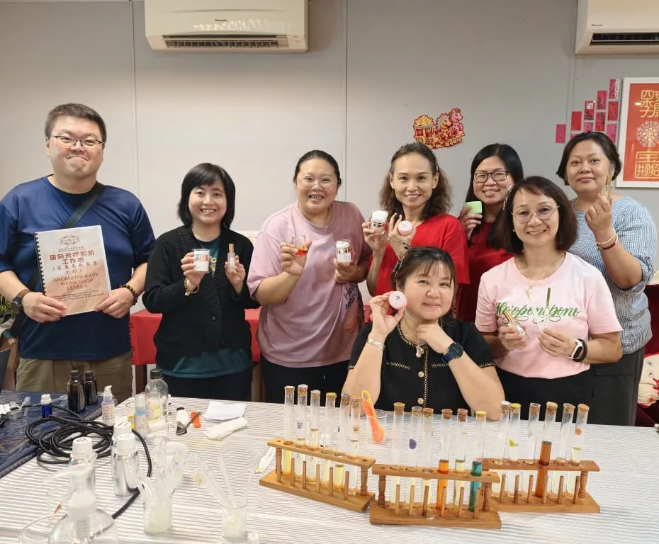 Aromatherapy workshop participants at Sunflower Aromatherapy Academy showing the products they made